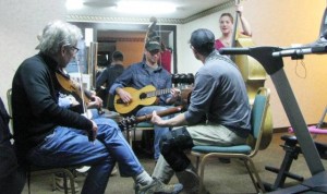 George, Caleb, Ron and Emily jamming in the exercise room